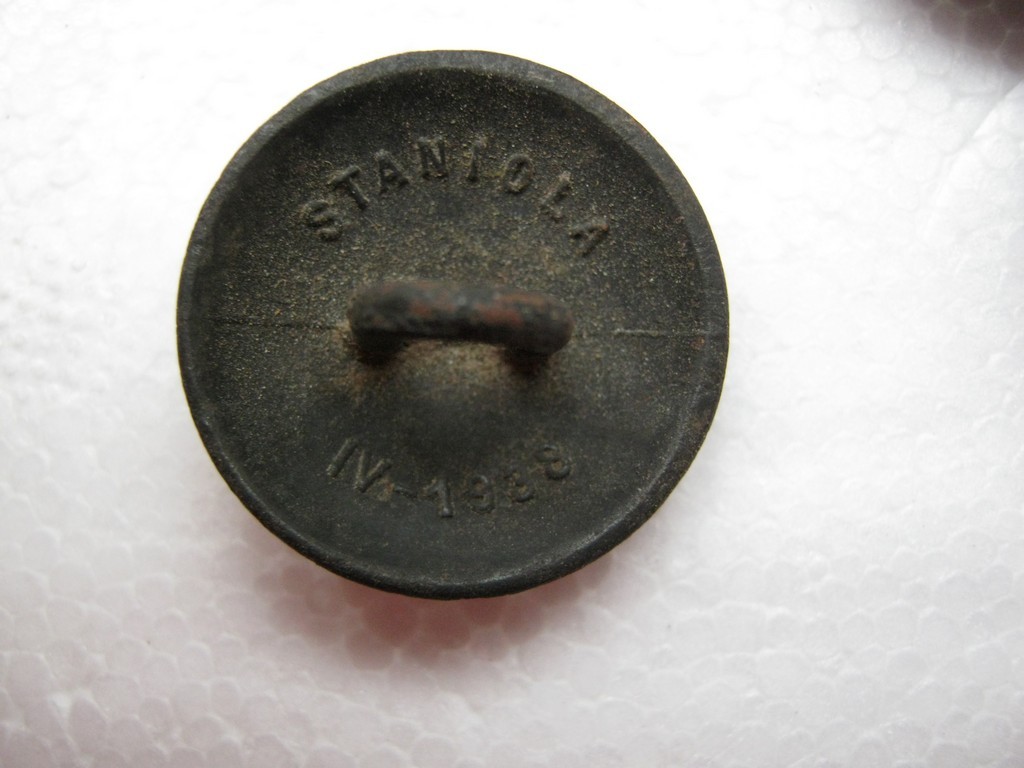 Date on the back side of polish military tunic button.